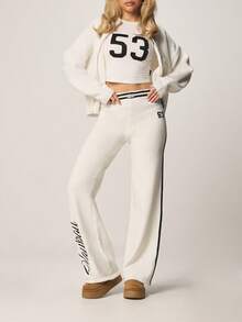 Missguided x Playboy 米白色针织阔腿裤，侧边饰有黑色撞色条纹和棒球数字印花细节，休闲舒适。 - 彩色 - 查看 5