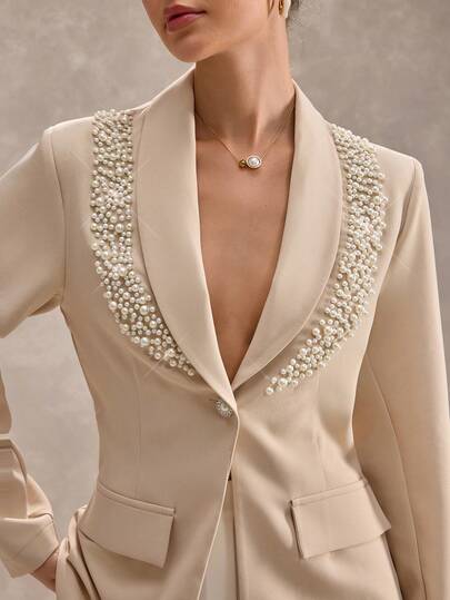CLARA VERO Beige Pearl Embellished Blazer With Corset Detail: Slim Fit, Great For Chic Events Or Elegant Dinners, Made From Non-Elastic Polyester Fabric With Structured Bodice, Statement Pearl Trim And Hidden Front Button