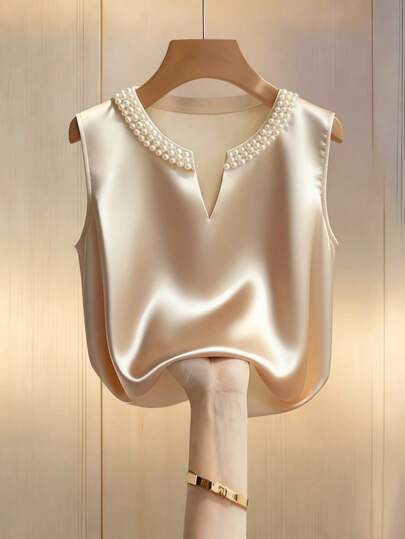 Franclia Women's Champagne-Colored Elegant Round Neck V-Neck Sleeveless Vest Shirt, Sparkly Top, Elegant Women's Shirt, Elegant Women's Top, Women's Casual Top, Beach, Summer Holiday Outfit, Spring Clothing, Women's Spring Outfit, Women's Valentine's Day Outfit, Carnival Outfit, Women's Beach Outfit, Summer Holiday Outfit, Vacation, Women's Vacation Outfit, Embellished With Pearls, Made Of Satin Material, Loose Fit, Suitable For Commuting, Showing Everyday Elegance. Suitable For All Seasons, Best Friend Outfits, Birthday Parties, New Year's And Spring Festival Celebrations; Suitable For New Year's Eve, Parties, Beach Activities; Both Elegant And Casual; Elegant Wedding Banquets, Suitable For Romantic Dates, Valentine's Day, And Dating Occasions; Graduation And Back-To-School Season Outfit; Fashionable Casual Commuting Wear; Business Office Wear; Diverse And Fashionable Everyday Casual Wear; Urban Teacher Professional Attire.
