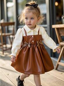 SHEIN Playful Pals 女婴立领泡泡袖两用A字连衣裙。经典A字廓形，适合各种体型的宝宝。独特的立领设计增添了一丝正式感，巧妙的泡泡袖设计则甜美俏皮。两用设计营造出视觉层次感。无论是外出还是居家休闲，这款连衣裙都能展现您宝宝活泼可爱的一面。 - 彩色 - 查看 3