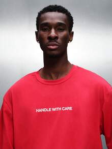 PLAYBOY X SUMWON Cropped Fit Graphic Tee With Script Logo And Handle With Care Text Print Short Sleeve Red Cotton - Red - View 5