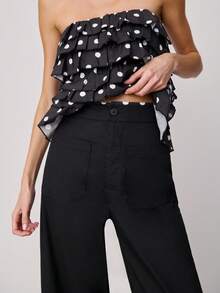 Nöista Pantalones de pierna ancha y cintura alta con bolsillos delanteros y volantes con estampado de lunares en el bajo. Estos pantalones combinan un estilo clásico con un detalle llamativo y divertido, ideales para la primavera, las vacaciones de primavera, la primavera, el estilo casual y la moda de vacaciones. - Negro - Ver 4