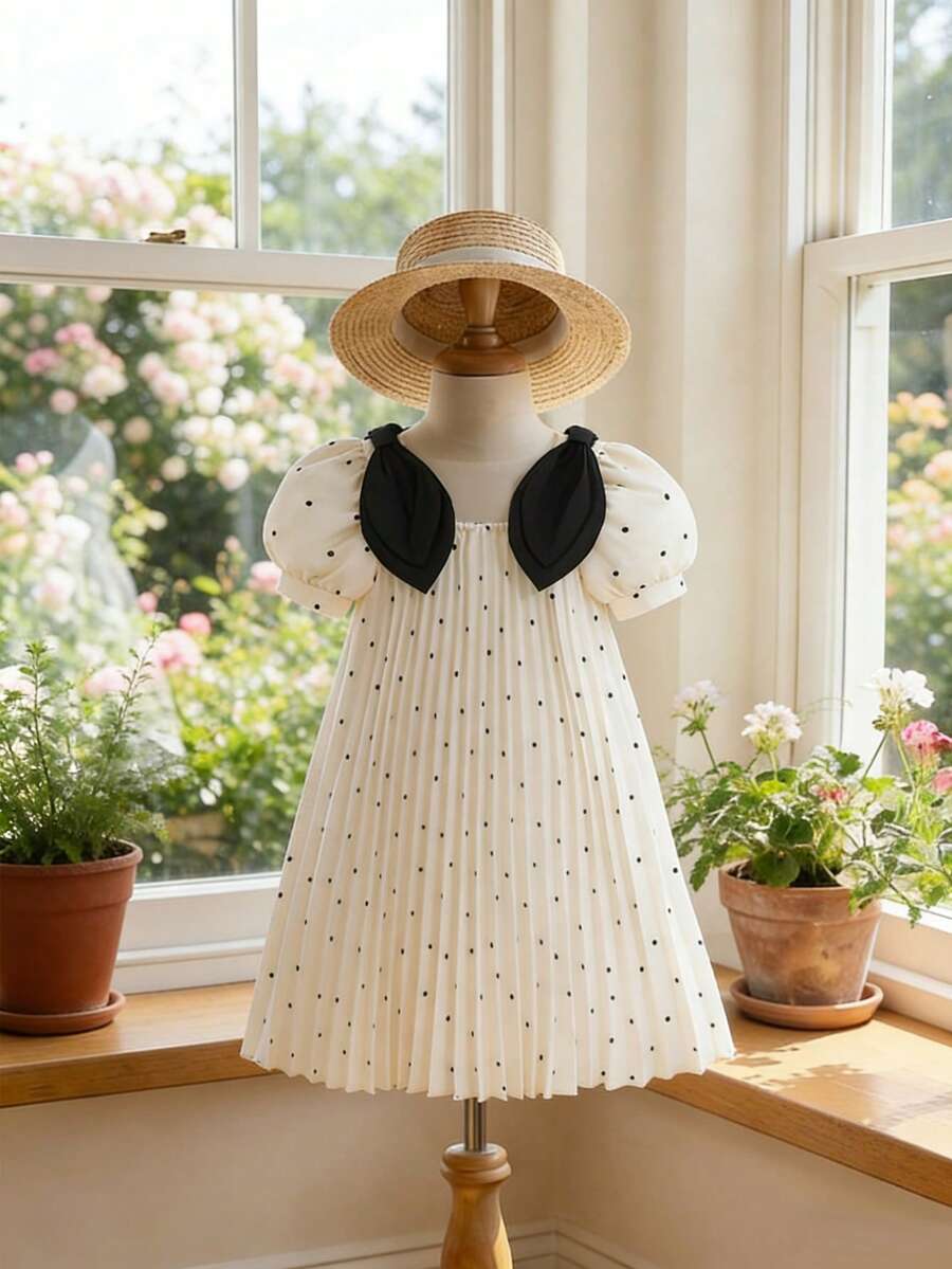 SHEIN Đầm mùa hè mới về cho bé gái, tay phồng, họa tiết chấm bi kiểu Pháp, trang trí nơ, phù hợp cho các dịp thường nhật, thanh lịch, đi chơi và nghỉ lễ. - Màu be - Xem 1