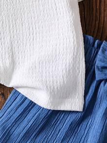 SHEIN Elladie kids مجموعة ملابس علوية كامي بطبعة جاكارد أيفوري مع تريم كشكش وشورت كشكش وردي، طقم صيفي جميل وجذاب للطفلة الصغيرة، تنورة زرقاء فاتحة، طقم ملابس أزرق وأبيض 2 قطعة، ملابس صيفية بطراز كلاسيكي للفتاة الصغيرة، طقم صيفي من قطعتين للأطفال، طقم ملابس أطفال من قطعتين، طقم شورت بطراز كلاسيكي جميل للأطفال - الأزرق - مشاهدة 7