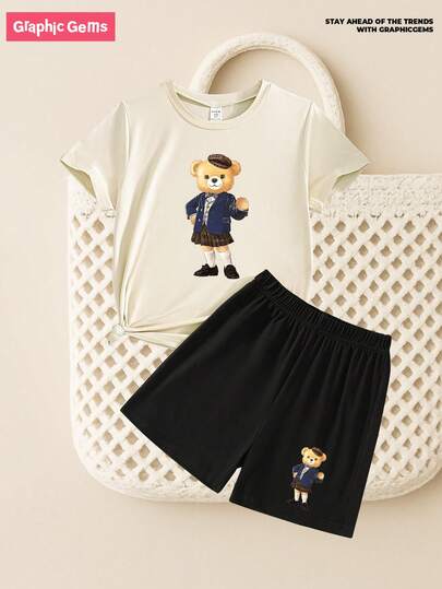 SHEIN GraphicGems 2pcs/Set Young Girls Casual Minimalist Bear Graphic Beige Round Neck Short Sleeve Top And Black Shorts, Collegiate Style Suitable For Summer Back To School, Cartoon Cute Daily Comfortable Outfit For Girls & Toddlers Bear Print Top Shorts Set Kids Graphic Tee Shorts Short Sleeve 2 Piece Kids