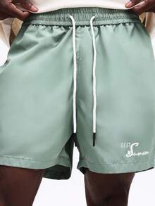 Quần short nam SUMWON kiểu dáng thường ngày, có dây rút, in chữ, dáng rộng thoải mái, cạp chun, thích hợp mặc hàng ngày, ở nhà hoặc đi nghỉ mát. - màu xanh lá - Xem 7