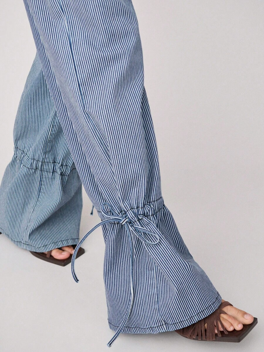 Nöista High-Waisted Pinstriped Pants With Large Front Patch Pockets, Belt Loops, And Button Closure. Unique Gathered Hems With Ties Create A Flared, Ruffled Silhouette, For Spring And Summer. - Blue - View 1