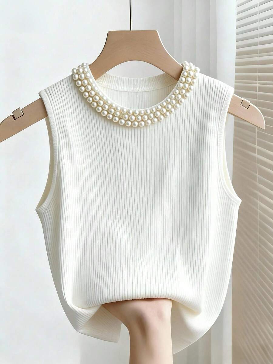 Franclia Áo thun nữ màu trắng gân sọc, cổ đính ngọc trai, không tay, thích hợp mặc hàng ngày, đi làm, dạo phố, uống trà chiều, hẹn hò. Áo tank top gân sọc, áo không tay, áo kiểu dáng thanh lịch, áo đính ngọc trai, áo màu ngà, áo đầm, áo dễ thương.