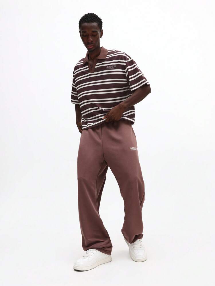 Ensemble polo rayé et pantalon de survêtement assorti
