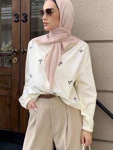 Mulvari Áo sơ mi dài tay thêu hoa dành cho nữ - Màu Hồng baby - Xem 2