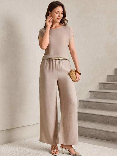 Miaspire This Women's Summer Two-Piece Set Features A Soft, Light Khaki Color Scheme, Exuding A Warm And Soothing Relaxed Feel. The Minimalist Solid Color Design Reveals A Gentle And Understated Elegance. The Silhouette Consists Of A Comfortable, Loose-Fitting Short-Sleeved Knit Top And Flowing Wide-Leg Trousers, Accentuated By A Thin Belt To Define The Waistline. The Lightweight And Breathable Fabric Is Versatile, Suitable For Various Occasions, Balancing Comfort And Style. Perfect For Summer, This Set Is Ideal For Daily Commutes, City Strolls, Or Outdoor Afternoon Tea. The Light Khaki Base Conveys An Elegant Style While The Simple Design Showcases Fashionable Taste, Making It A Practical And Stylish Choice For Your Summer Wardrobe.