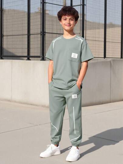 Vacaura 2pcs/Set Older Boys' Casual Simple White Striped Pocket Design Short Sleeve T-Shirt And Knit Drawstring Pants Sports Outfit, Spring/Summer Tween Boys Olive And White Set