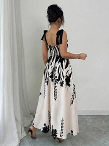 Elenzga 女士杏色底黑色花卉拼接无袖连衣裙，腰部收褶，裙摆呈喇叭形，优雅休闲度假风，适合狂欢节、劳动节、复活节、海滩、花园、旅行、春夏等场合。 - 彩色 - 查看 2