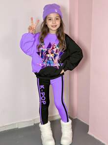 一套女童休闲卡通图案紫色和黑色撞色长袖圆领连帽卫衣和修身裤套装，适合春、秋、冬季外出穿着，韩流风格