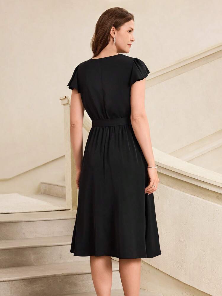 This Women's Summer Vacation Dress Features A Classic Pure Black Color And A Soft, Flowing Woven Fabric. The Minimalist Solid Color Design Exudes Understated Luxury. The Silhouette Includes A Round Neck, Short Flutter Sleeves, A Tie-Waist, And A Full Skirt. The Draping And Breathable Fabric Is Suitable For Various Occasions, While The Tie-Waist Design Flatters The Figure And Enhances Elegance. Perfect For Summer, It's Ideal For Beach Vacation Dinners, Casual City Gatherings, Or Romantic Dates. The Pure Black Base Conveys Elegance, While The Satin Finish Showcases Refined Fashion Sense. It's A Versatile And Stylish Piece For Any Vacation Wardrobe.Summer Outfits