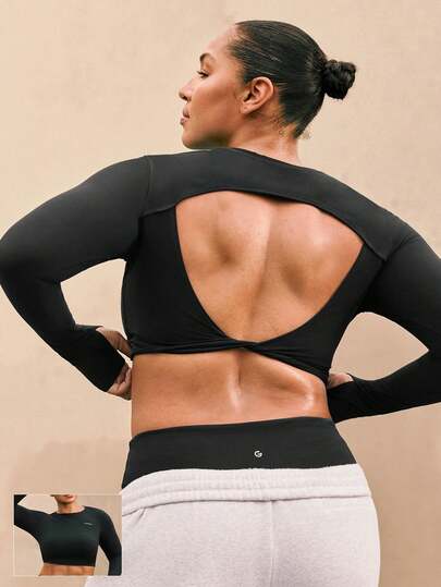 GLOWMODE Top corto de manga larga con diseño de espalda abierta retorcida, suave y mantequilloso, con ojales para el pulgar, para yoga de bajo impacto, uso diario casual, tallas grandes, con copas desmontables