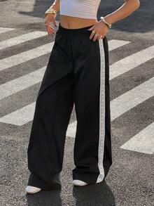 Muchica Women's Black Side-Striped Lace-Up Fitted Loose-Fit Sweatpants; Women's Black Pants; Loose-Fit Pants; Women's Trousers; Black Pants; Women's Sweatpants; Women's Wide-Leg Pants; Women's Black Sweatpants - Black and White - View 1