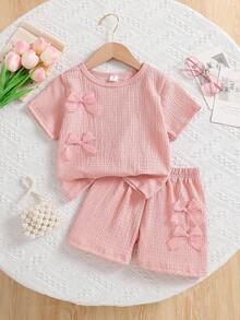2件套女童纯色3D蝴蝶结装饰圆领短袖T恤搭配松紧腰休闲短裤，适合日常休闲和度假穿着，夏季 - 粉色 - 查看 3