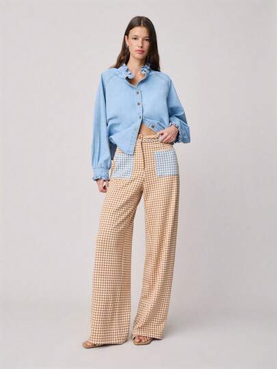 Nöista 中腰格纹长裤，配有撞色蓝色格纹口袋和腰部，裤腿宽松。适合春夏穿着。