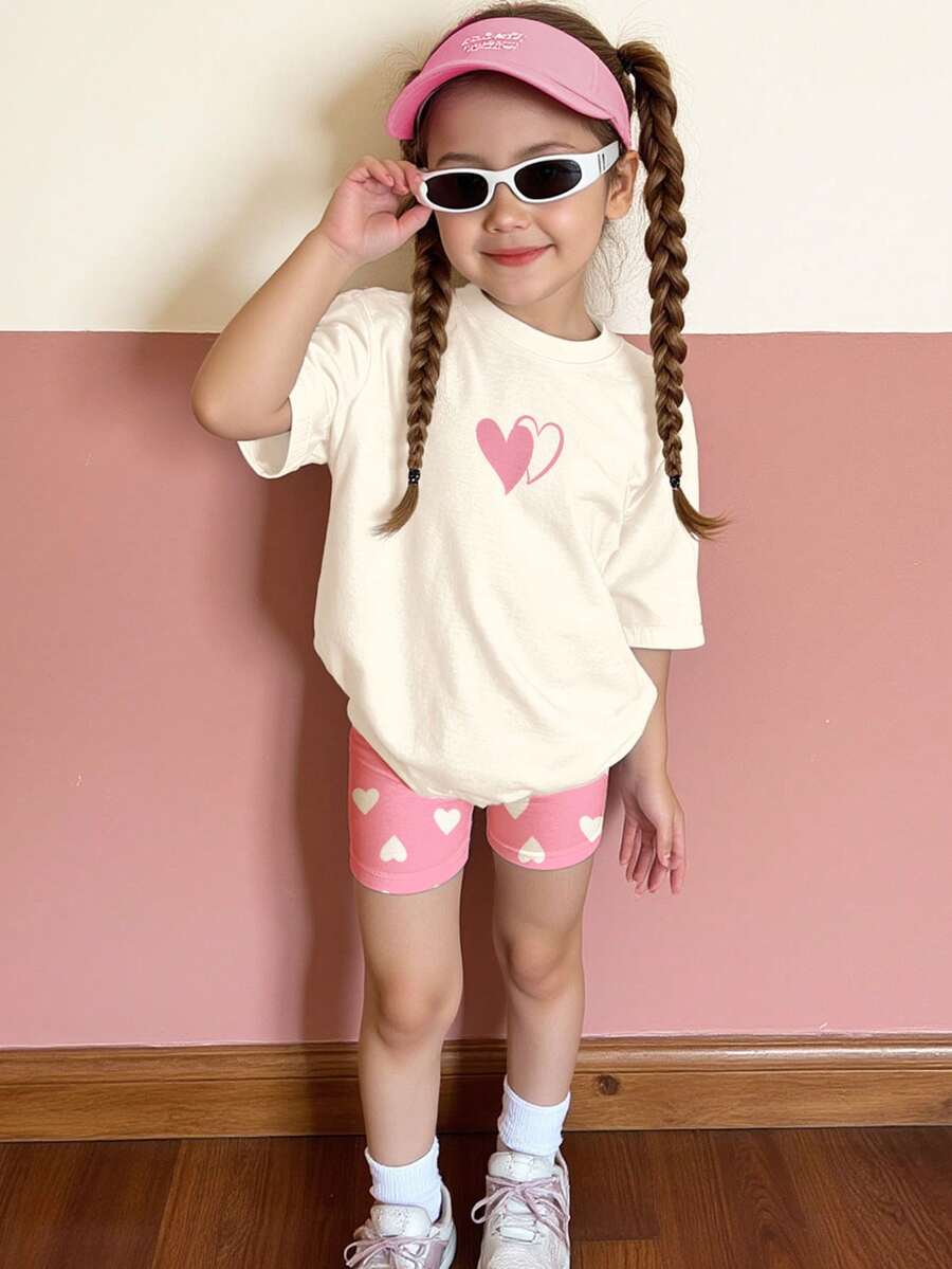 SHEIN Cream White & Pink, Sweet Minimalist Heart Pattern Print, Cute Deer Outfit, Young Girl Casual Comfortable Soft Loose Round Neck Short Sleeve T-Shirt And Tight Cycling Shorts, Suitable For Spring/Summer Daily, Home, Vacation, Holidays, Pink Valentine's Day Atmosphere, Spring & Summer Outfits For , Easy Comfort, Stylish Little Girl Set, Casual Wear, Kids Heart Graphic Clothes, Spring & Summer Set, New Style, Chill Chill - Multicolor - View 1