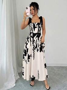 Elenzga 女士杏色底黑色花卉拼接无袖连衣裙，腰部收褶，裙摆呈喇叭形，优雅休闲度假风，适合狂欢节、劳动节、复活节、海滩、花园、旅行、春夏等场合。 - 彩色 - 查看 5