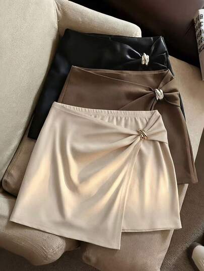 Franclia Falda corta de línea A asimétrica de color albaricoque con botones metálicos, para uso casual y diario