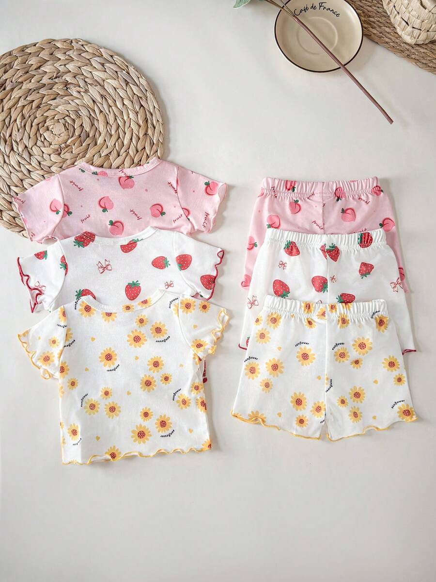 SHEIN 6件套女宝宝可爱草莓、蝴蝶结、桃子、向日葵、字母和数字印花圆领短袖上衣和松紧腰短裤,休闲舒适,适合夏季户外玩耍 - 彩色 - 查看 1