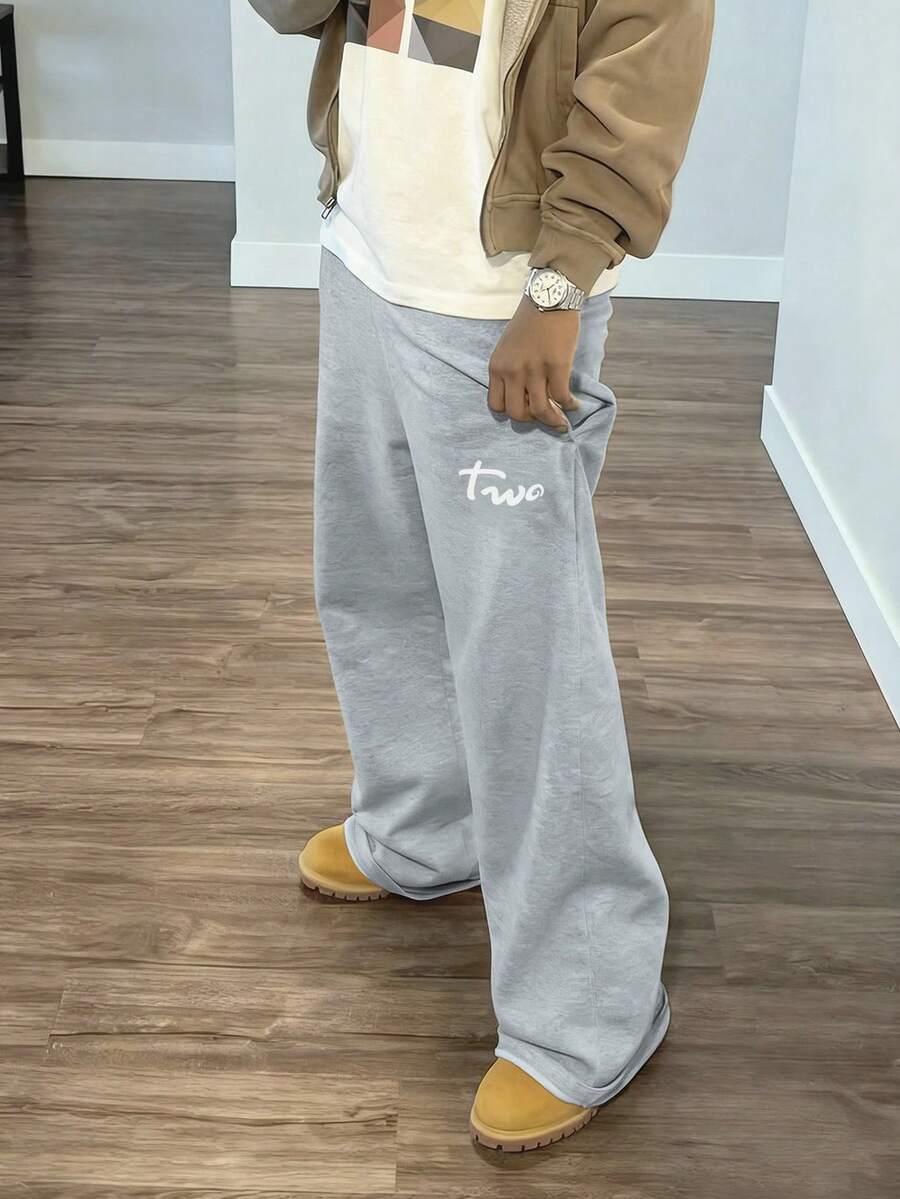 Manfinity Dauomo Men's Casual Y2K English Letter Graphic Streetwear Flared Sweatpants, & Unique, Spring/Summer - Light Grey - View 1