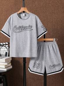 SHEIN Bộ đồ thể thao cho bé trai tuổi teen, gồm áo tay ngắn và quần short, kiểu dáng rộng rãi, thoải mái, đa năng, họa tiết in và ruy băng phối màu tương phản, phù hợp mặc hàng ngày, đi học, du lịch, thể thao và trang phục mùa xuân hè. - Xám - Xem 4