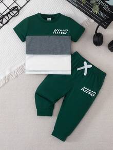 SHEIN Playful Pals Bộ 2 món cho bé trai gồm áo thun ngắn tay cổ tròn in chữ phối màu và quần cạp chun, thích hợp mặc hàng ngày, trang phục bé trai, mùa thu, phù hợp cho bé trai 3 tuổi, quần áo trẻ sơ sinh và trẻ nhỏ, mùa thu. - Nhiều màu - Xem 2