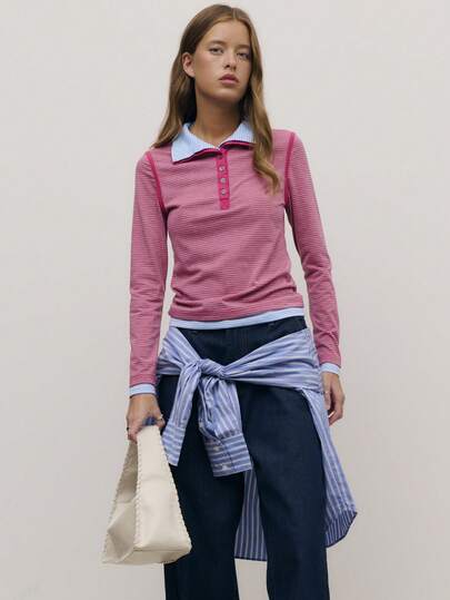 Nöista 这款休闲条纹上衣采用撞色领口和纽扣门襟设计，既俏皮又不失女性魅力，是春假穿搭或日常穿着的理想之选。它将运动元素与修身剪裁完美融合，尽显女性魅力。