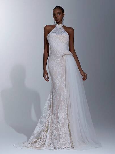 Elitara 优雅、奢华、浪漫的弹力蕾丝面料露背吊带裙，正面薄纱拼接，高腰褶皱设计显瘦侧边，夸张网纱垂坠，鱼尾拖尾，适合婚礼、正式晚宴、新娘礼服。