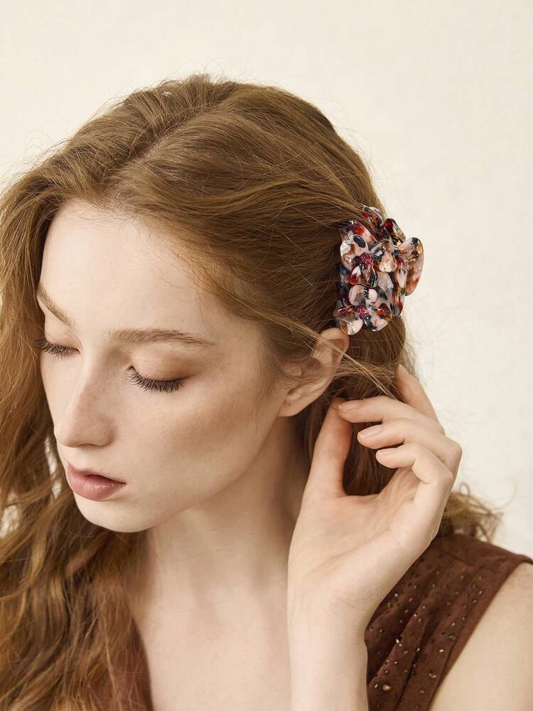 Fermaglio per capelli con dettagli in strass e decorazione floreale tridimensionale