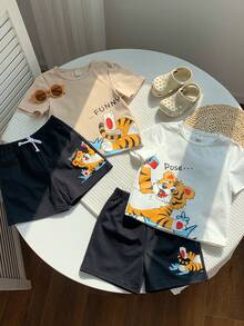 SHEIN Conjunto de 4 piezas de camiseta y pantalones cortos con estampado de tigre lindo para niño pequeño - Multicolor - Ver 6