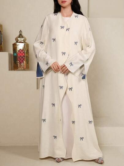 Yasmyna 保守休闲款阿拉伯女式罩袍，饰有蝴蝶结刺绣和波浪形门襟