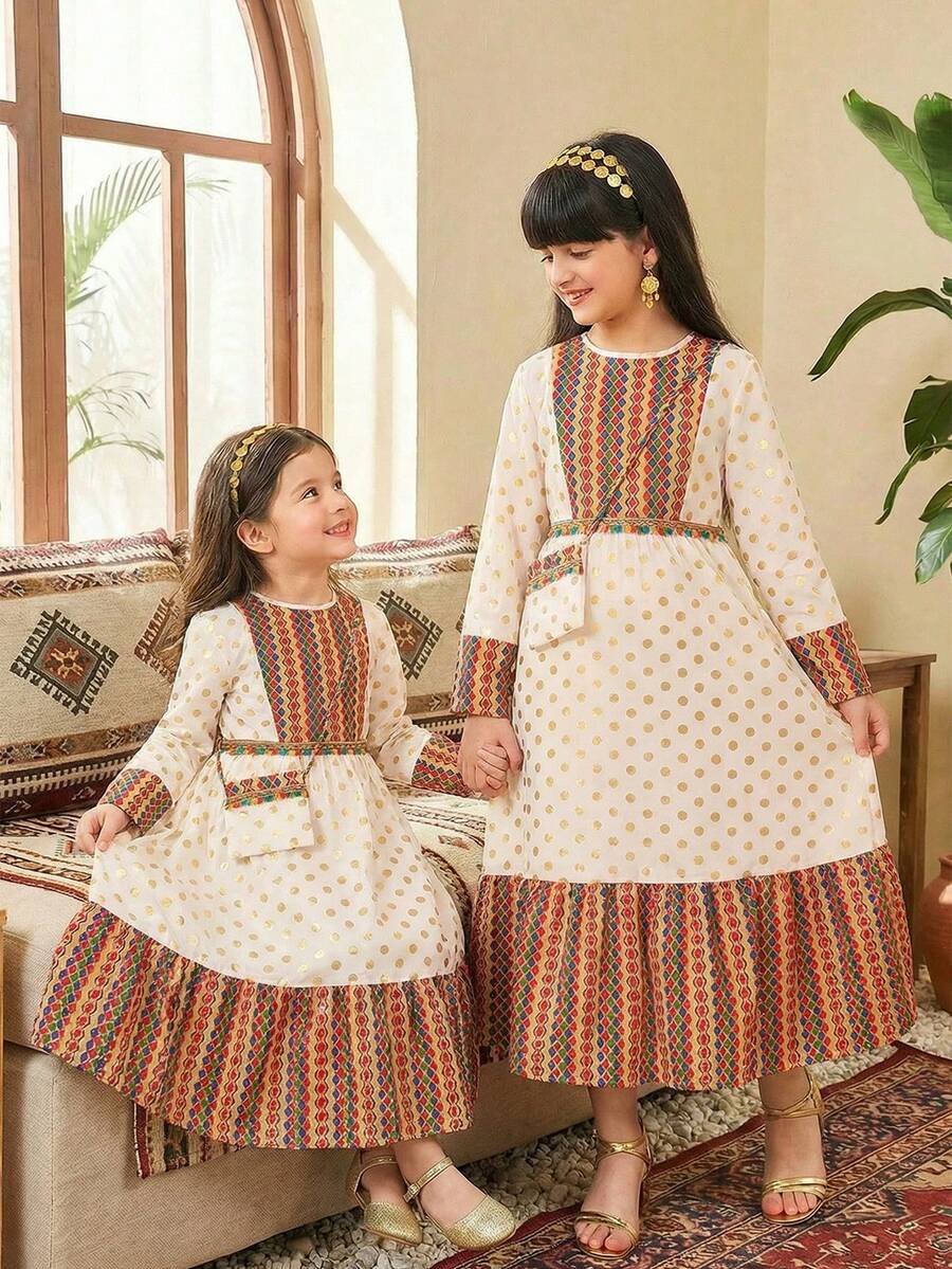 SHEIN Young Girls' Dress, Featuring Beige Base Fabric With Golden Polka Dots, Colorful Geometric Floral Panels On Bodice, Hem And Cuffs, Decorated With Colorful Tassels At Waist, Matching Printed Pouch, Suitable For Festivals And Cultural Events, Lightweight Fabric For Spring/Summer/Autumn