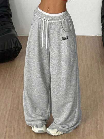 SHEIN Pantalones de chándal informales para niñas preadolescentes con cintura con cordón, bolsillos y pernera ancha con gráfico de letras