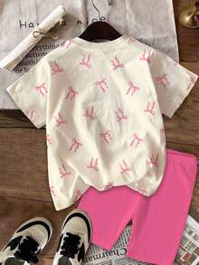 SHEIN Bộ 2 món cho bé gái, kiểu dáng thường ngày, dễ thương, họa tiết mèo thắt nơ, thời trang ngọt ngào, áo thun ngắn tay cổ tròn màu kem hồng công chúa và quần legging, thích hợp cho mùa xuân/hè, thu/đông, mặc hàng ngày, trong nhà/ngoài trời, ngày lễ tình nhân, phong cách Y2K, dễ thương, ấm áp cho trẻ em, thời trang thu đông cho trẻ em, phong cách mới mùa thu, thời trang hoa nở, quần áo bé gái. - Nhiều màu - Xem 3