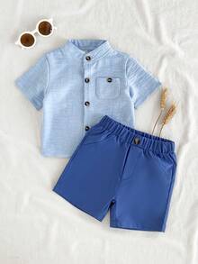Vintaside Kids Bộ đồ mùa hè thời trang cho bé trai gồm áo sơ mi trắng tay ngắn cổ đứng đa năng phối cùng quần short tối giản, thích hợp cho kỳ nghỉ, du lịch, tụ họp và tiệc tùng. - Màu xanh lam - Xem 1