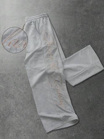 Pantalon de survêtement ample avec poche en biais et broderie de lettre, style décontracté polyvalent pour hommes