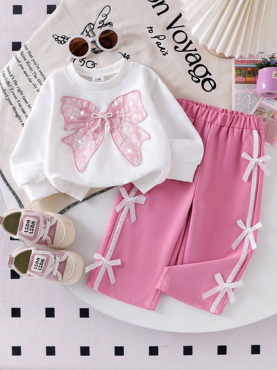 SHEIN Bộ 2 món cho bé gái sơ sinh/trẻ nhỏ: áo thun cổ tròn dệt kim và quần dài có nơ thắt lưng dệt kim đính sequin hình bướm, trang phục thể thao thời trang, mùa thu/đông.