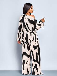 SOLERSUN Bộ đồ hai mảnh thời trang cỡ lớn dành cho nữ, họa tiết da báo gợi cảm mới, kiểu trễ vai, tay dài và thắt eo, áo xếp ly một bên có dây rút và quần ống loe ôm sát, chất liệu dệt kim, thích hợp cho các bữa tiệc, đi làm hàng ngày, tiệc tùng sang trọng nhẹ nhàng, lễ hội âm nhạc, năm mới, mùa thu, mùa đông. - Đen và trắng - Xem 4