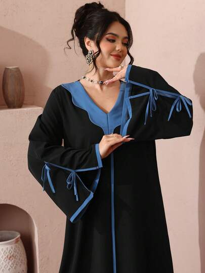 Al Najma Women's Black Stretchy Long Sleeve Bow V-Neck Elegant Arabic DressElegant Colorblock Arabian Dress In Black With Blue Trim V Neck And Long Ribbon Detail Sleeves