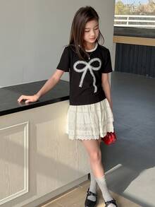 DAZY Camiseta de manga corta con cuello redondo, lazo decorativo y tejido para niñas preadolescentes, otoño - Negro - Ver 1