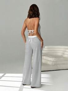 SHEIN EZwear Bộ 2 món gồm áo hai dây buộc phía trước hở lưng và quần ống rộng có dây rút, thích hợp cho hộp đêm, kỳ nghỉ, bãi biển, tiệc tùng, Hawaii và nhiều dịp khác. Họa tiết kẻ sọc đen trắng. - Nhiều màu - Xem 2