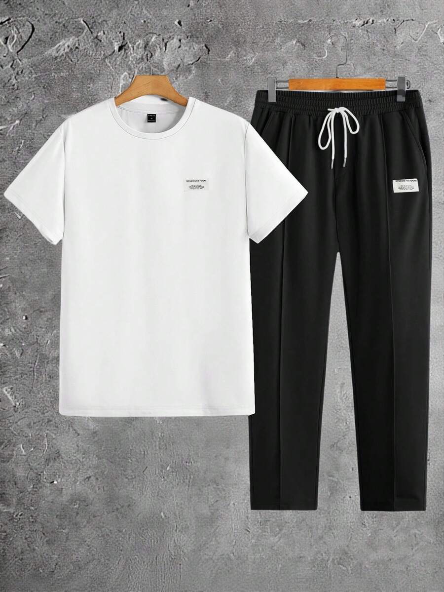 Manfinity BRENVOR 2 sztuki/zestaw męski, swobodny, patchworkowy T-shirt z dzianiny, dopasowany krój, okrągły dekolt, krótki rękaw, spodnie ze ściągaczem w pasie, czarno-biały strój letni, odpowiedni do noszenia na co dzień, przytulne stroje