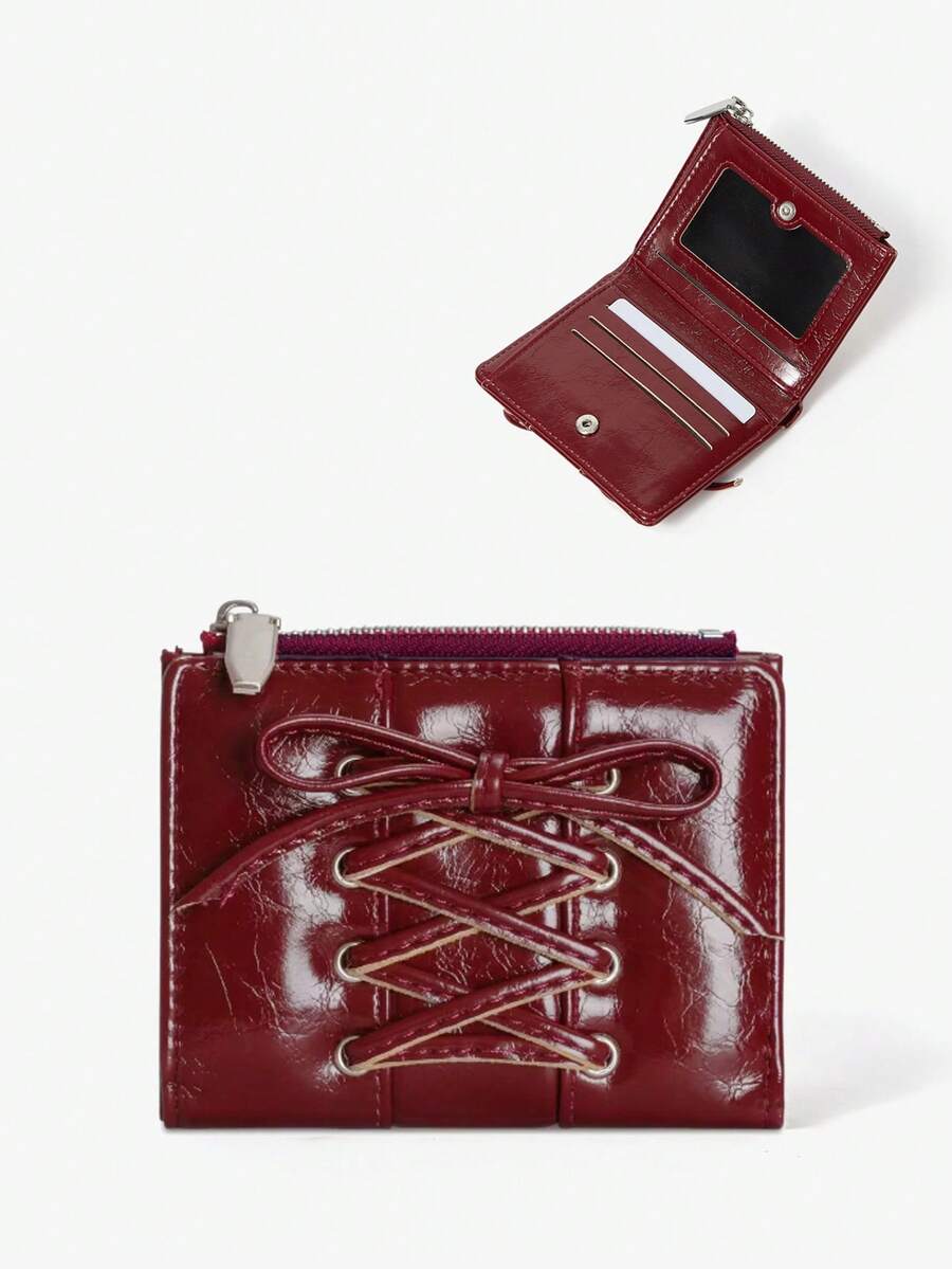 Viva Strut 这款时尚简约百搭的黑色仿皮短款钱包，采用系带蝴蝶结和对折设计，Y2K风格，是送给甜美酷女孩、性感女孩、新年和情人节的完美礼物之选。