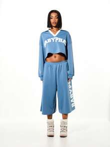 BABYPHAT Pantalón corto de chándal de pierna ancha con logo de varsity y texto impreso en el lateral para ropa de estar en casa en otoño - Azul - Ver 3