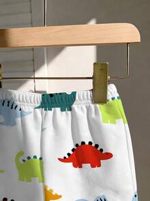 SHEIN Playful Pals 幼儿男童恐龙卡通印花圆领短袖T恤和配套弹力腰短裤套装，儿童服装，婴幼儿套装，婴幼儿短袖短裤套装，男婴套装，男婴T恤套装，恐龙元素。适合春夏穿着，夏季尺码，适合6个月至3岁宝宝。 - 白色 - 查看 5