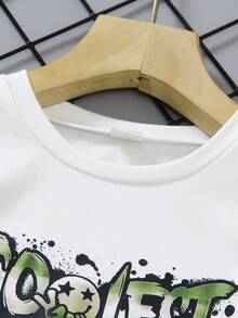 2pcs/Set Young Boys' Outfit, Includes White Short Sleeve T-Shirt With "COOLEST" Graffiti Print And Military Green Cargo Pants. Casual And Style To Showcase Kids' Lively And Energetic Personalized.